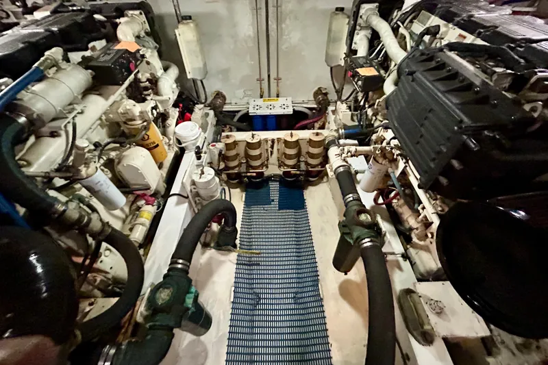 Slide: The Image of Engine room of a 2000 Pacific Mariner 65 Motoryacht, showcasing mechanical components. - 89