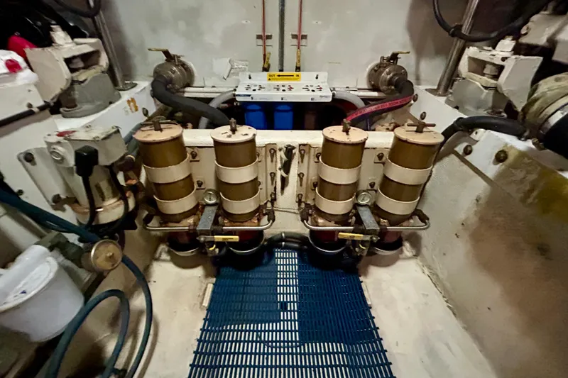 Slide: The Image of Engine room of 2000 Pacific Mariner 65 Motoryacht with mechanical components and piping. - 90
