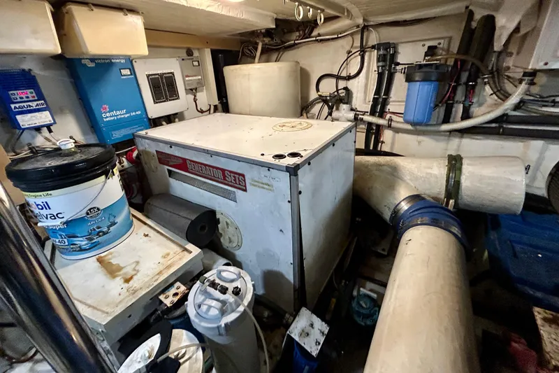 Slide: The Image of Engine room of a 2000 Pacific Mariner 65 Motoryacht with generator and equipment. - 91