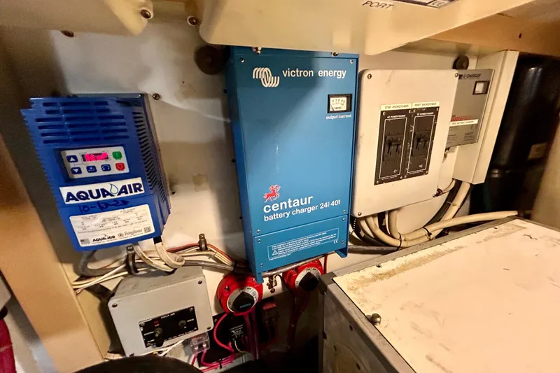 Slide: The Image of Electrical panel and battery charger in 2000 Pacific Mariner 65 Motoryacht engine room. - 95