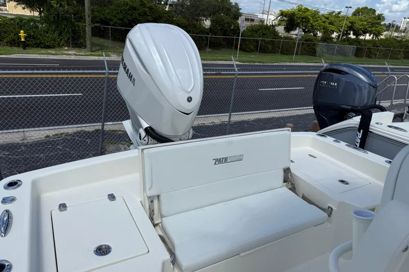 Slide: The Image of Pathfinder F350XSA2 2026 boat with Yamaha outboard motors, parked near a road. - 10