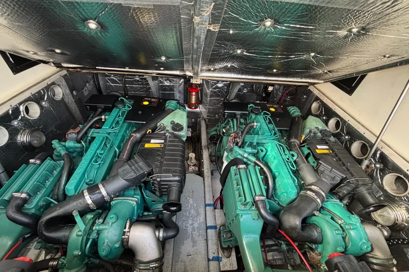 Slide: The Image of Engine room of a 2004 Carolina Classic sport fishing boat, featuring dual engines. - 20