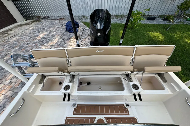 Slide: The Image of 2020 Scout 251 XSS boat on calm blue water, aerial view. - 12