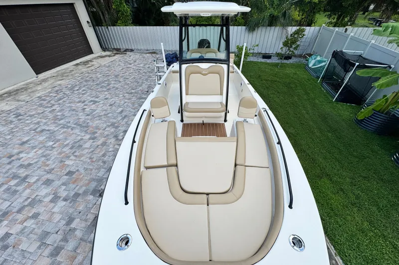 Slide: The Image of 2020 Scout 251 XSS boat cockpit with steering wheel and navigation display. - 24