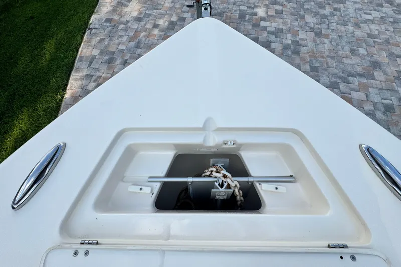 Slide: The Image of 2020 Scout 251 XSS boat interior with open storage compartments and seating. - 31