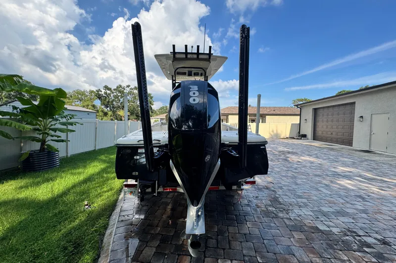 Slide: The Image of 2020 Scout 251 XSS boat on calm water, featuring a sleek design and powerful Mercury engine. - 6