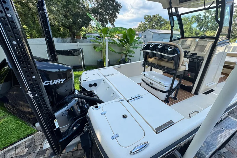 Slide: The Image of 2020 Scout 251 XSS boat on water, featuring sleek design and powerful engine. - 7