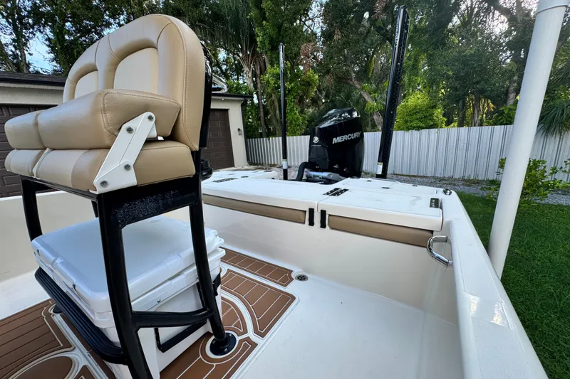 Slide: The Image of 2020 Scout 251 XSS boat on water, featuring sleek design and Mercury engine. - 9