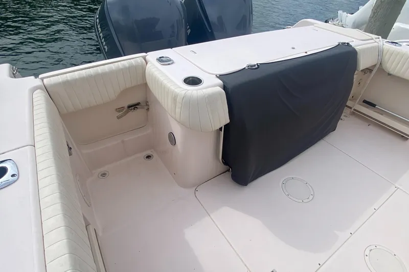 Slide: The Image of 2014 Grady-White Canyon 306 boat deck with seating and covered storage. - 10