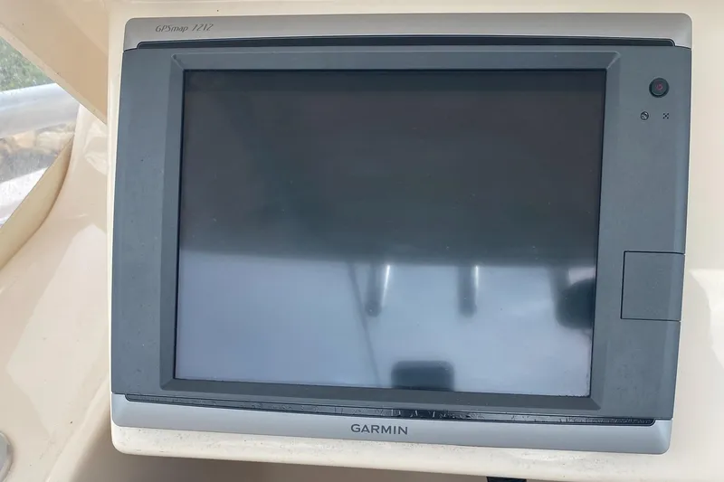 Slide: The Image of Garmin marine GPS system on 2014 Grady-White Canyon 306 boat dashboard. - 16