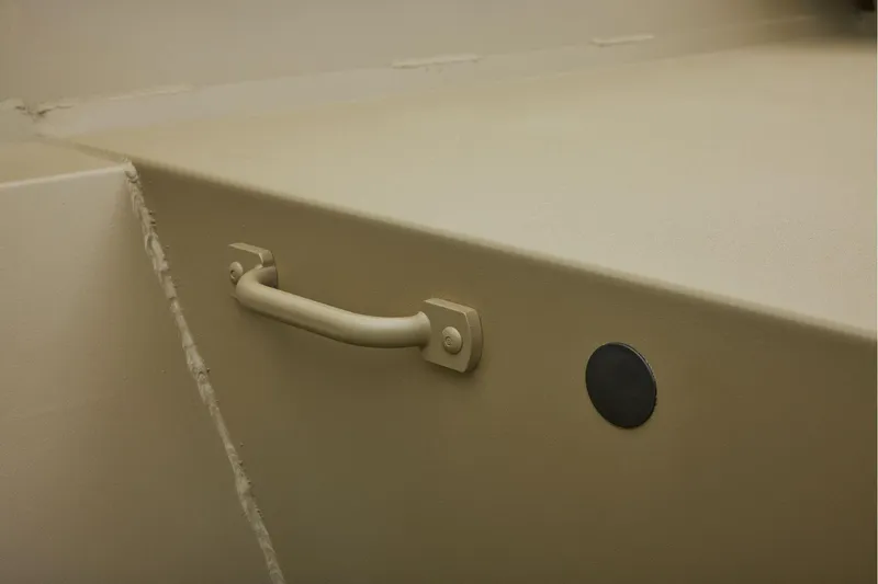 Slide: The Image of Manufacturer Provided Image: Handle and plug on 2025 Tracker GRIZZLY 2072 Utility boat interior. - 9