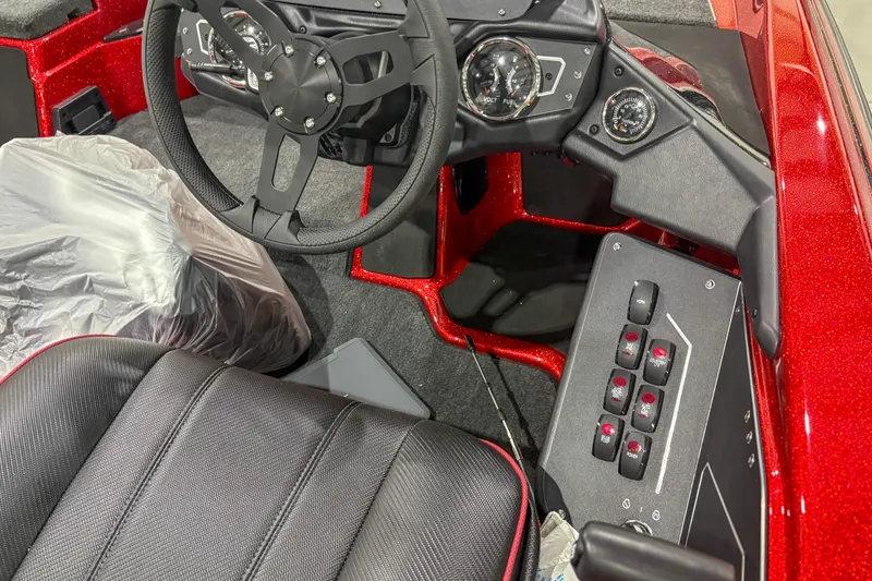Slide: The Image of 2026 Skeeter ZXR19 boat cockpit with steering wheel and control panel. - 12