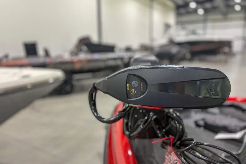 Slide: The Image of Close-up of a 2026 Skeeter ZXR19 boat control panel in a showroom. - 3