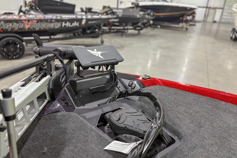 Slide: The Image of Interior of a 2026 Skeeter ZXR19 boat with advanced control panel and steering. - 4