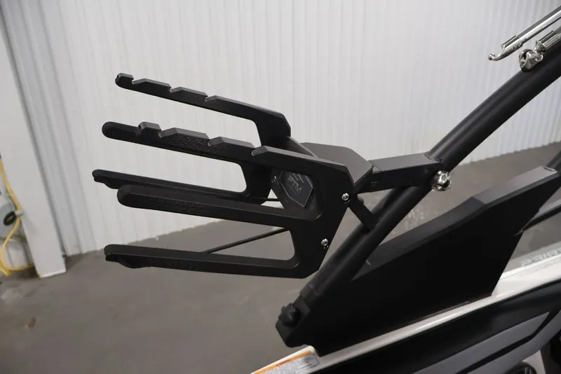 Slide: The Image of Wakeboard rack on 2026 Yamaha Boats 222XE, featuring sleek black design. - 34