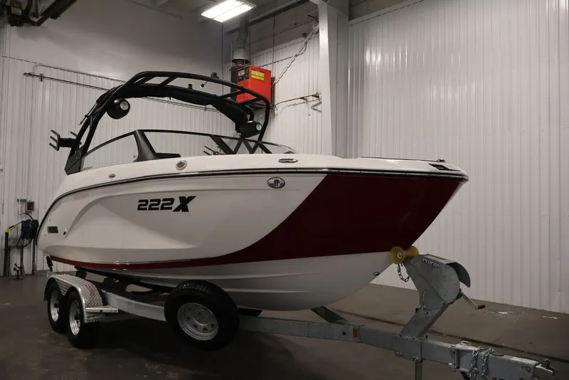 Slide: The Image of 2026 Yamaha Boats 222XE on trailer in indoor storage facility. - 3