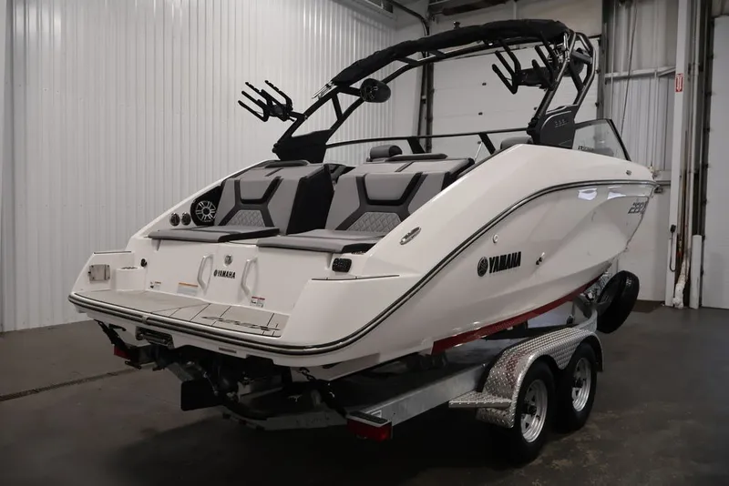 Slide: The Image of 2026 Yamaha Boats 222XE on trailer in indoor storage facility. - 5