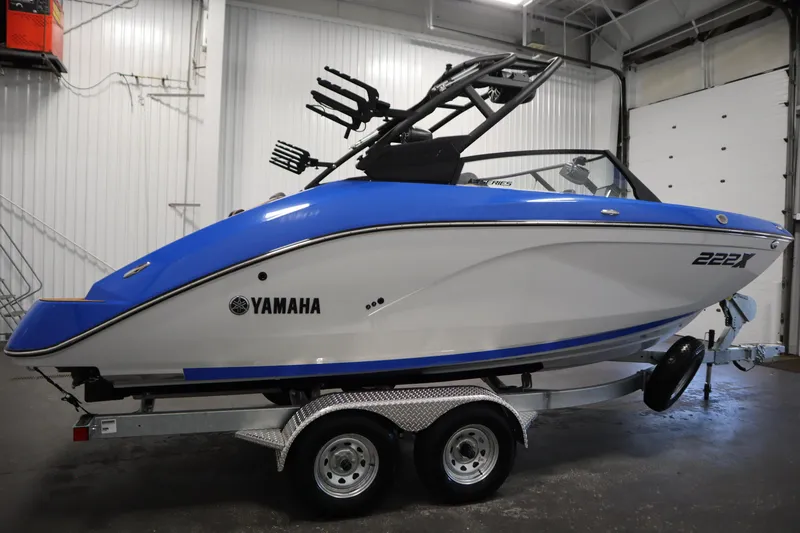 Slide: The Image of Yamaha Boats 2026 222XE interior detail showing storage compartment and control panel. - 3