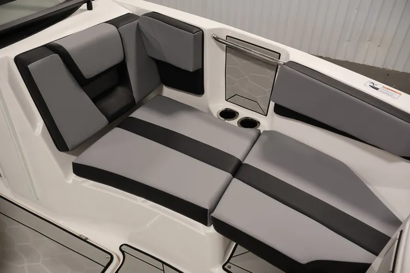 Slide: The Image of 2026 Yamaha Boats 222XE interior seating with gray and black cushions, cup holders, and sleek design. - 13