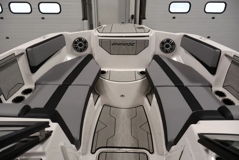Slide: The Image of 2026 Yamaha Boats 222XE interior with sleek seating and modern design. - 18