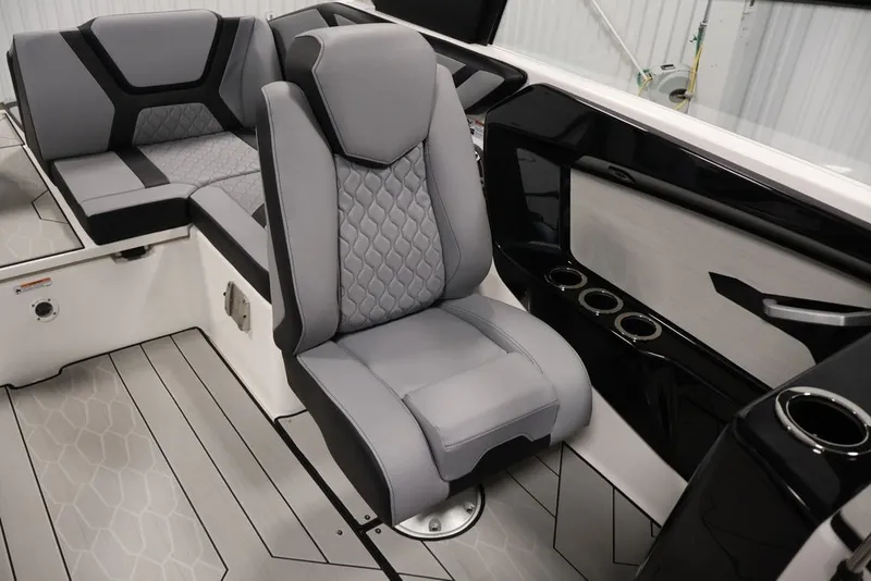 Slide: The Image of 2026 Yamaha Boats 222XE interior with sleek gray seating and modern design. - 26