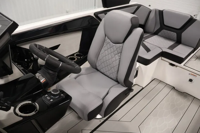 Slide: The Image of 2026 Yamaha Boats 222XE interior with sleek gray seating and modern steering console. - 21