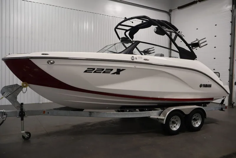 Slide: The Image of 2026 Yamaha Boats 222XE on trailer in indoor showroom setting. - 7