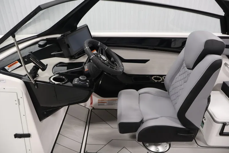 Slide: The Image of 2026 Yamaha Boats 222XE cockpit with modern steering and comfortable seating. - 12