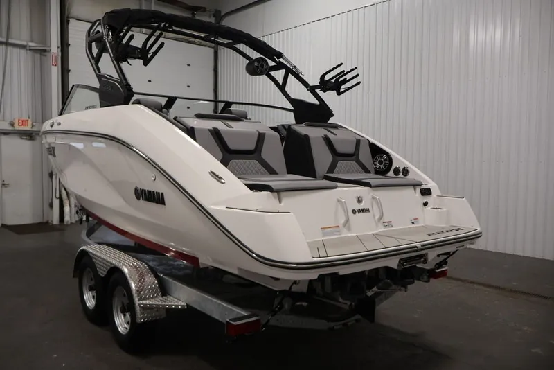 Slide: The Image of 2026 Yamaha Boats 222XE on trailer in indoor storage facility. - 8