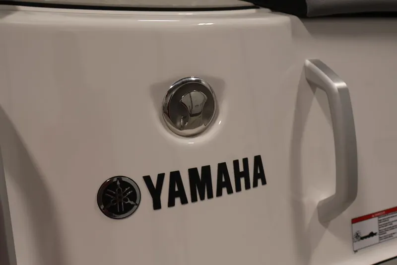 Slide: The Image of 2026 Yamaha Boats 222XE logo and handle detail on white surface. - 37