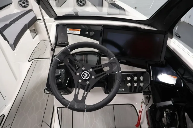 Slide: The Image of 2026 Yamaha Boats 222XE cockpit with steering wheel, touchscreen, and control panel. - 14
