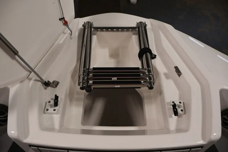 Slide: The Image of 2026 Yamaha Boats 222XE bow storage with stainless steel ladder. - 15