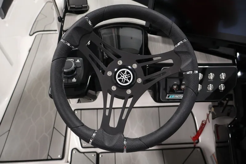 Slide: The Image of Steering wheel of 2026 Yamaha Boats 222XE, featuring sleek design and modern controls. - 16