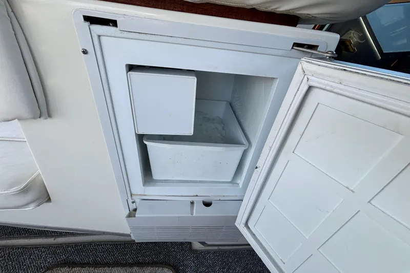 Slide: The Image of Open ice maker on 1989 Sea Ray 400 Express Cruiser boat. - 14