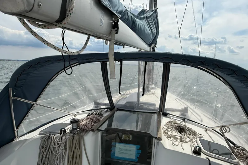 Slide: The Image of 2003 Beneteau Oceanis Clipper 361 sailboat cockpit view on open water. - 11