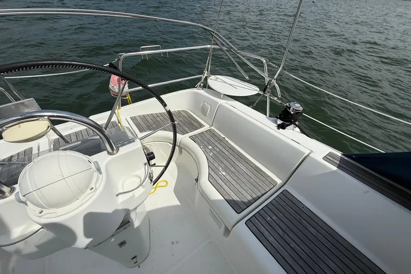 Slide: The Image of Cockpit of 2003 Beneteau Oceanis Clipper 361 sailboat with steering wheel and seating. - 12