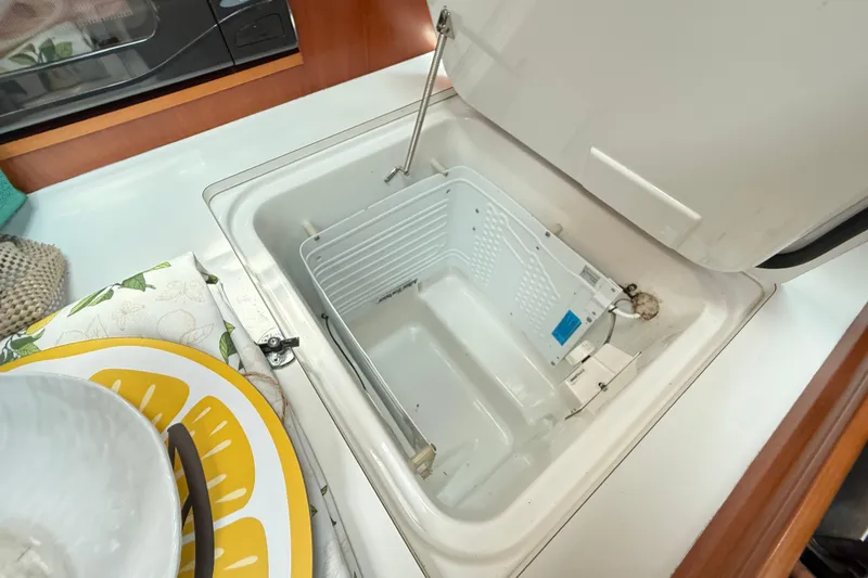 Slide: The Image of Open storage compartment in 2003 Beneteau Oceanis Clipper 361 yacht kitchen. - 27