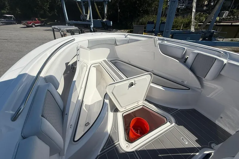Slide: The Image of 2023 Aquasport 2500 Center Console boat interior with open storage compartments. - 25