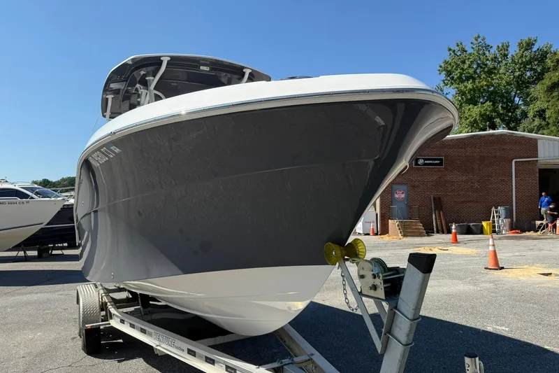 Slide: The Image of 2023 Aquasport 2500 Center Console boat on trailer, outdoor display. - 4