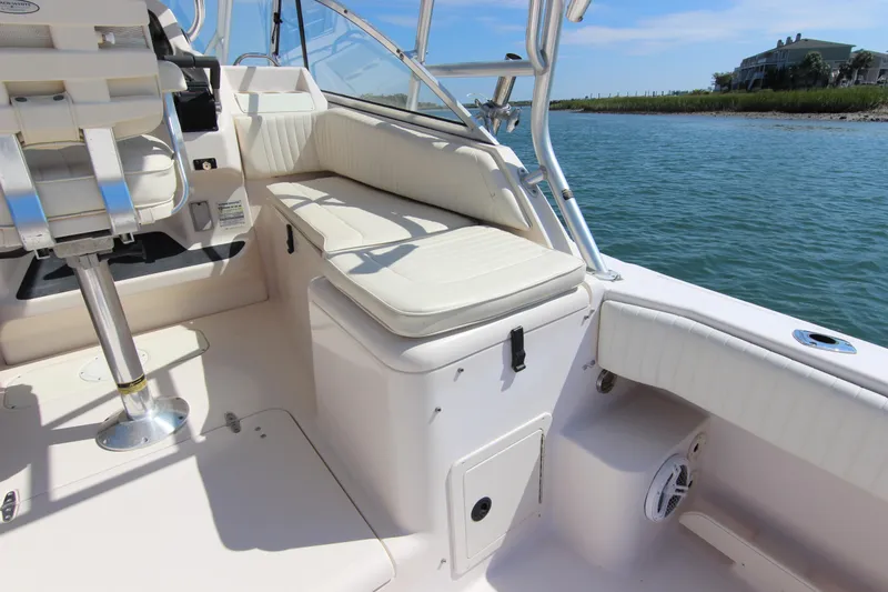 Slide: The Image of 2001 Grady-White Express 265 boat interior with seating, on calm water. - 16