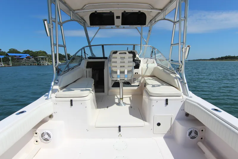 Slide: The Image of 2001 Grady-White Express 265 boat interior with seating, helm, and ocean view. - 18