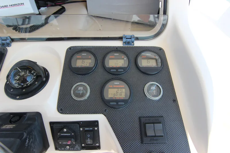 Slide: The Image of Dashboard of 2001 Grady-White Express 265 boat with gauges and controls. - 22