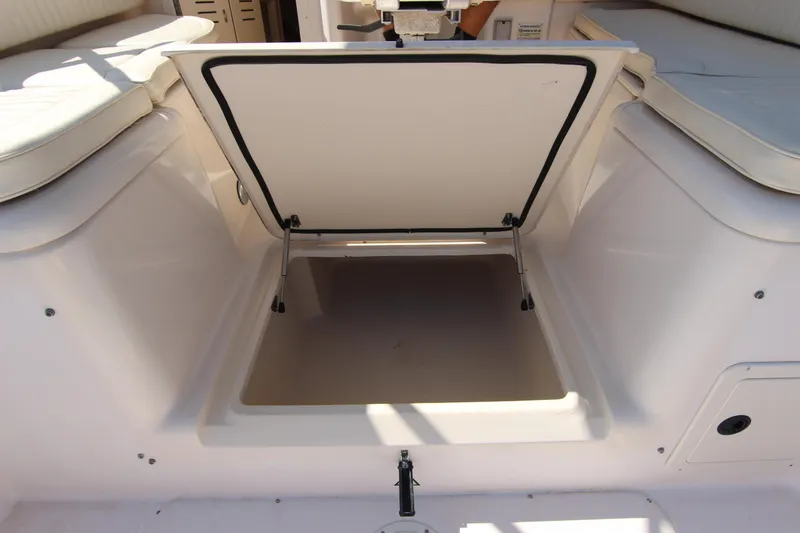 Slide: The Image of Open storage compartment on 2001 Grady-White Express 265 boat. - 31