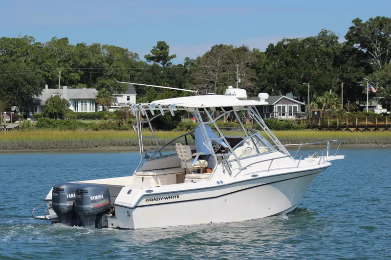 Slide: The Image of 2001 Grady-White Express 265 boat cruising on a scenic waterway. - 4