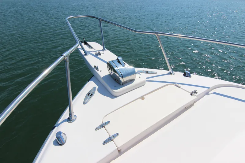 Slide: The Image of 2001 Grady-White Express 265 boat bow with railing on calm water. - 9