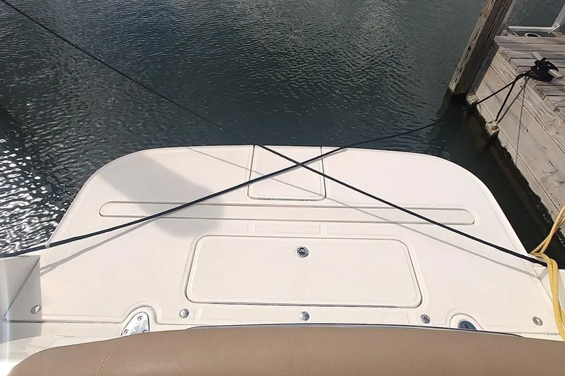 Slide: The Image of 2017 Sea Ray Sundancer 310 swim platform at dock, secured with ropes. - 10