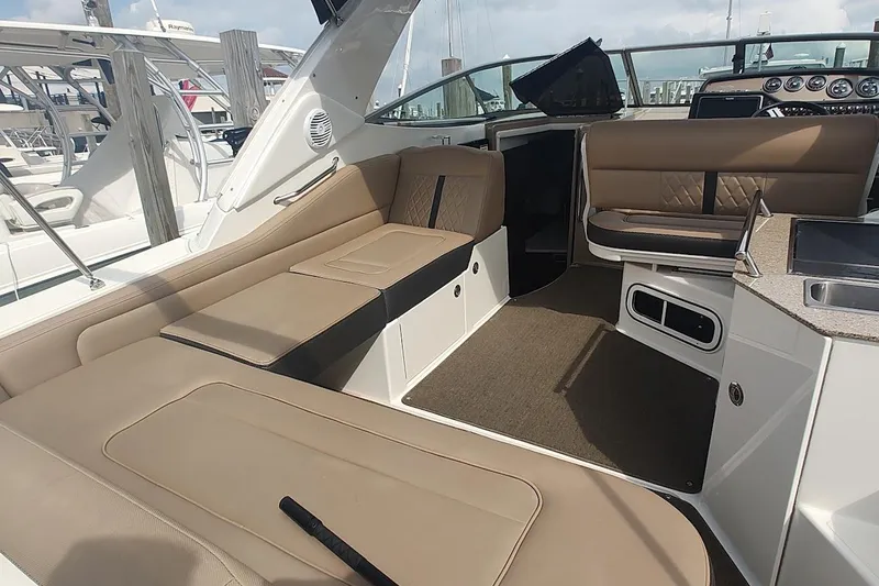 Slide: The Image of Luxurious interior of 2017 Sea Ray Sundancer 310 with beige seating and modern amenities. - 17