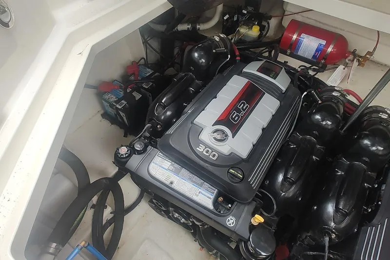 Slide: The Image of Engine compartment of 2017 Sea Ray Sundancer 310 with 6.2L engine and fire extinguisher. - 37