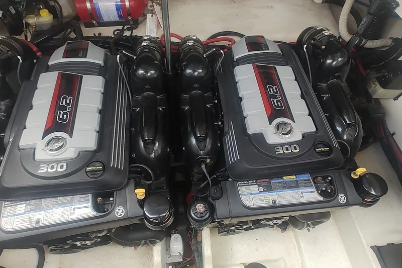 Slide: The Image of Twin 6.2L engines in a 2017 Sea Ray Sundancer 310 boat engine compartment. - 38