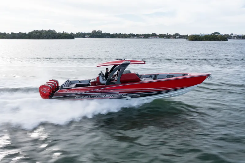 The Image of 2022 Concept 39' Open boat speeding on water, featuring sleek red design and powerful engines. - 0
